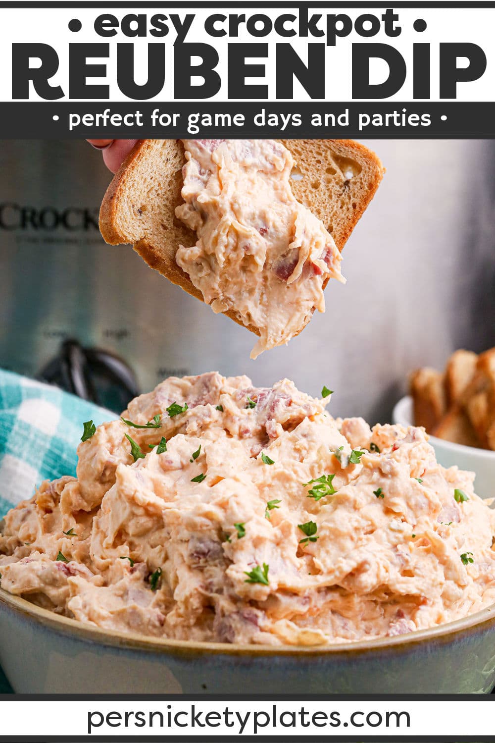 This slow cooker Reuben dip has all the best qualities and flavors of the classic Reuben sandwich in the form of a dip made with salty corned beef, cream cheese, Swiss cheese, tangy sauerkraut, and thousand island dressing. There's nothing more comforting than a warm creamy dip and it's even better when it's a true dump-and-set recipe like this one! | www.persnicketyplates.com
