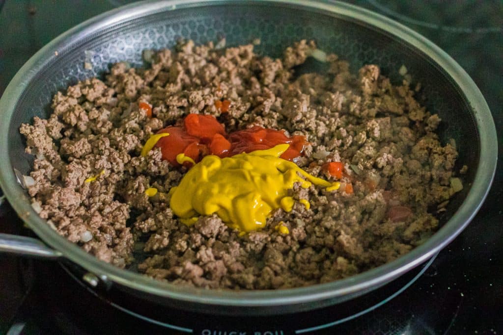 skillet with ground beef, ketchup & mustard.