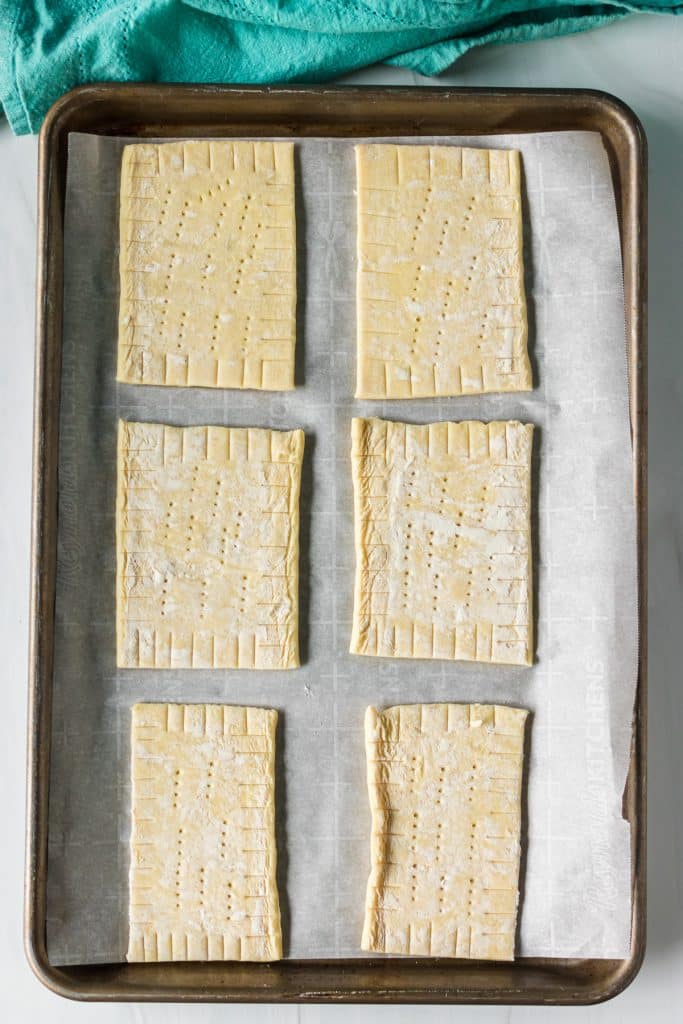 overhead shot of puff pastry rectangles on a baking sheet.