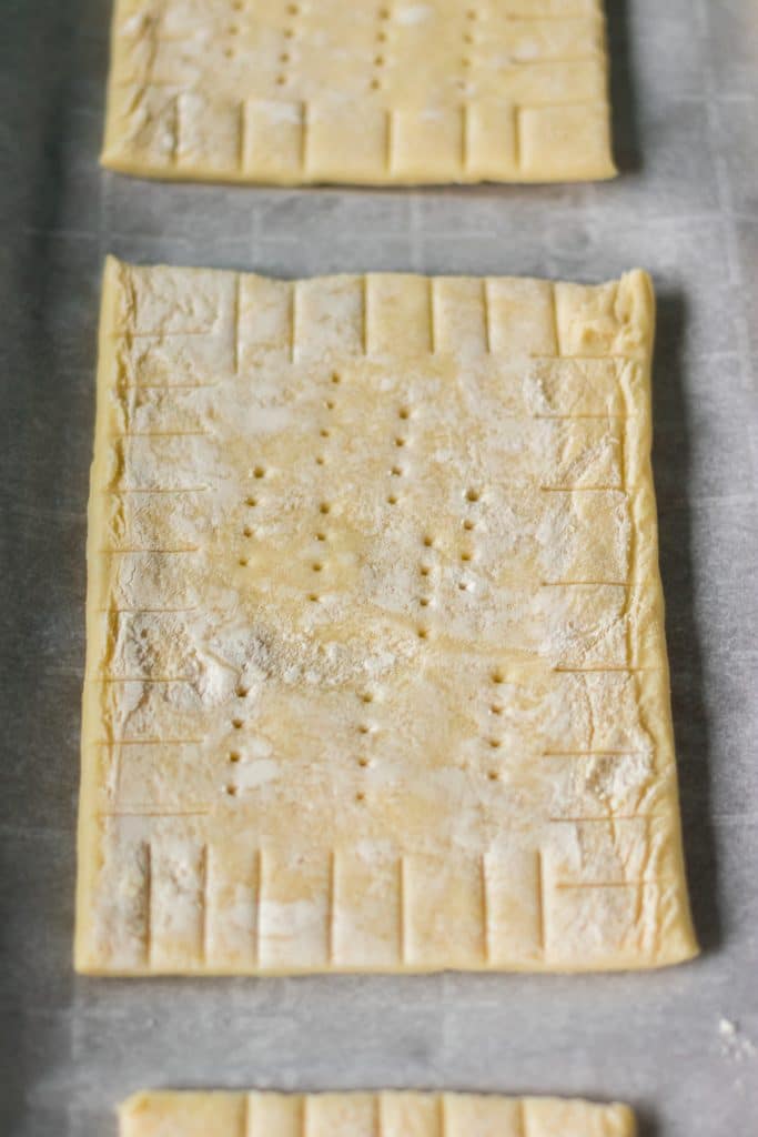 closeup of scored puff pastry rectangle.