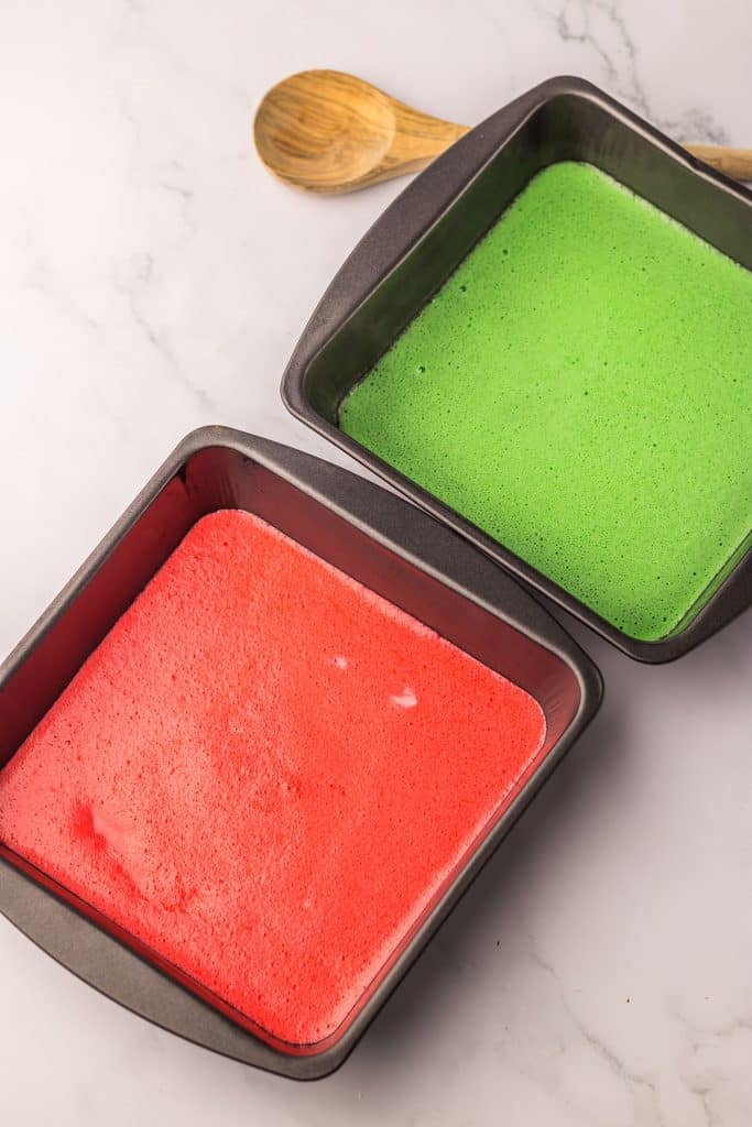 square baking dishes with red and green liquid gelatin.