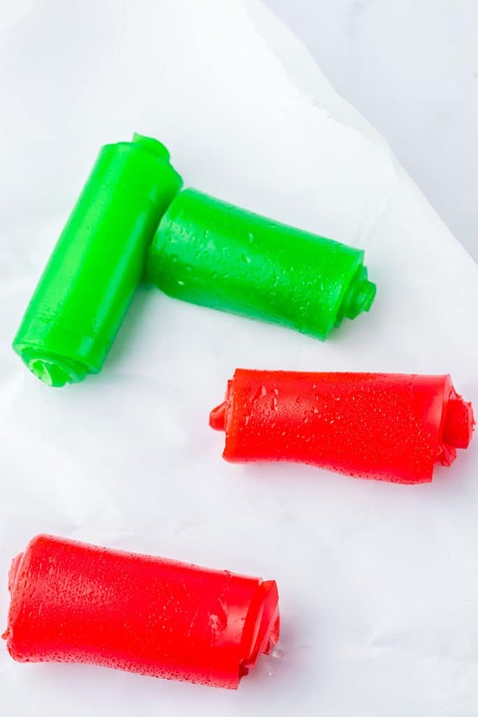 overhead shot of red and green jello rolls before being sliced.