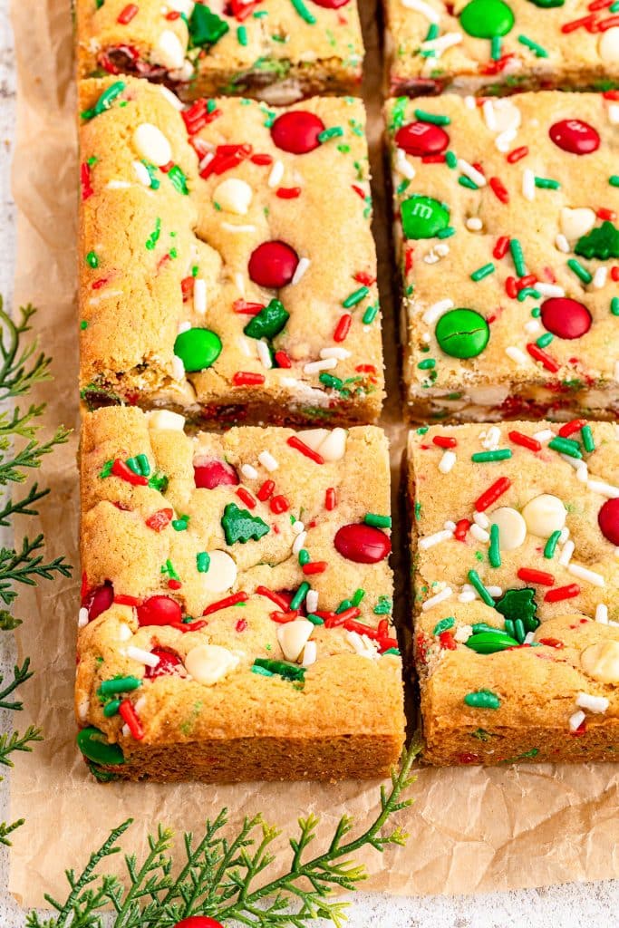 closeup of christmas cookie bars with red & green sprinkles.