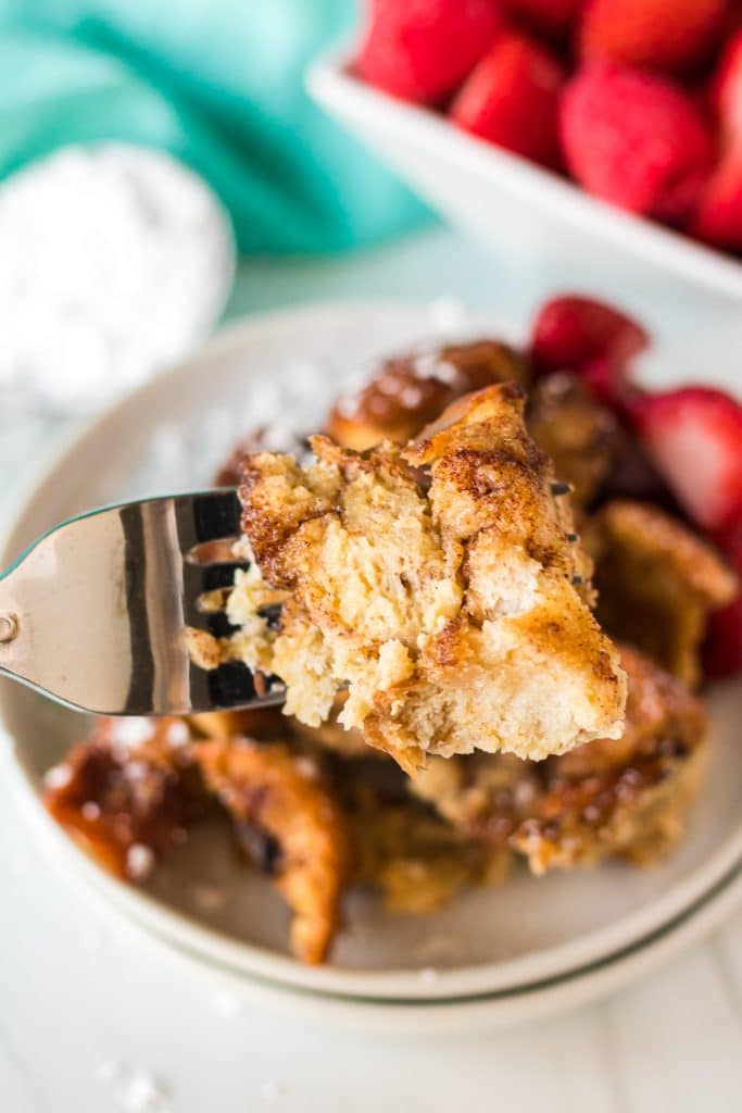 bite of french toast casserole on a fork.