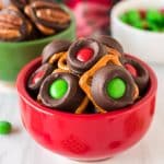 red bowl filled with christmas rolo pretzels.