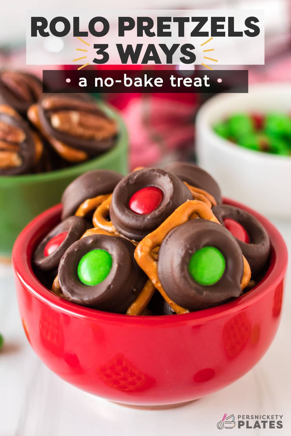 Rolo pretzels are a bite-size treat that requires only 3 ingredients and no baking! Depending on whether you top them with another pretzel, a pecan, or a holiday M&M, you have the choice between 3 different versions. I, for one, think you should make all 3. I can never decide on my favorite variation, so I make them all! | www.persnicketyplates.com