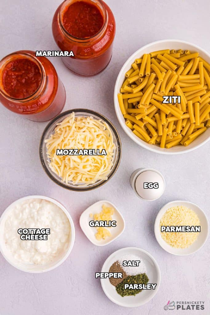 overhead shot of labeled ingredients laid out to make baked ziti.