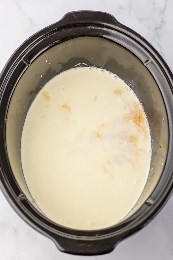 overhead shot of white hot chocolate in a slow cooker.