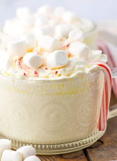 mug of peppermint white hot chocolate topped with marshmallows.