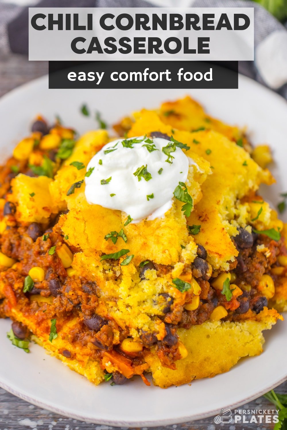 This chili cornbread casserole with Jiffy mix tastes like your mom’s chili but is topped with a layer of sweet and crispy cornbread. It’s the definition of Southern comfort food but super easy! | www.persnicketyplates.com
