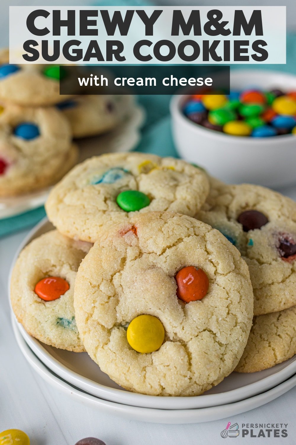 Chewy M&M Sugar Cookies - just like the Sugar Butter Cookies from the mall! Soft, chewy, and loaded with colorful M&Ms to suit any occasion. They're made with simple baking staples and a secret ingredient, making these the best, chewiest, most decadent sugar cookies you've ever had! | www.persnicketyplates.com