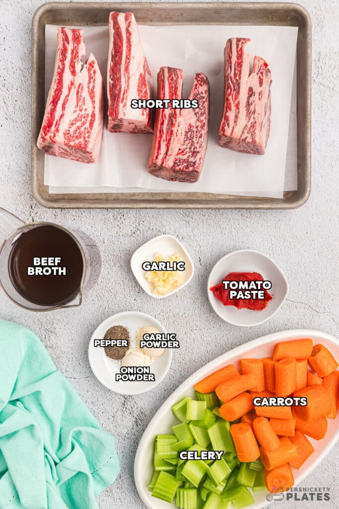 overhead shot of labeled ingredients laid out to make crockpot short ribs.