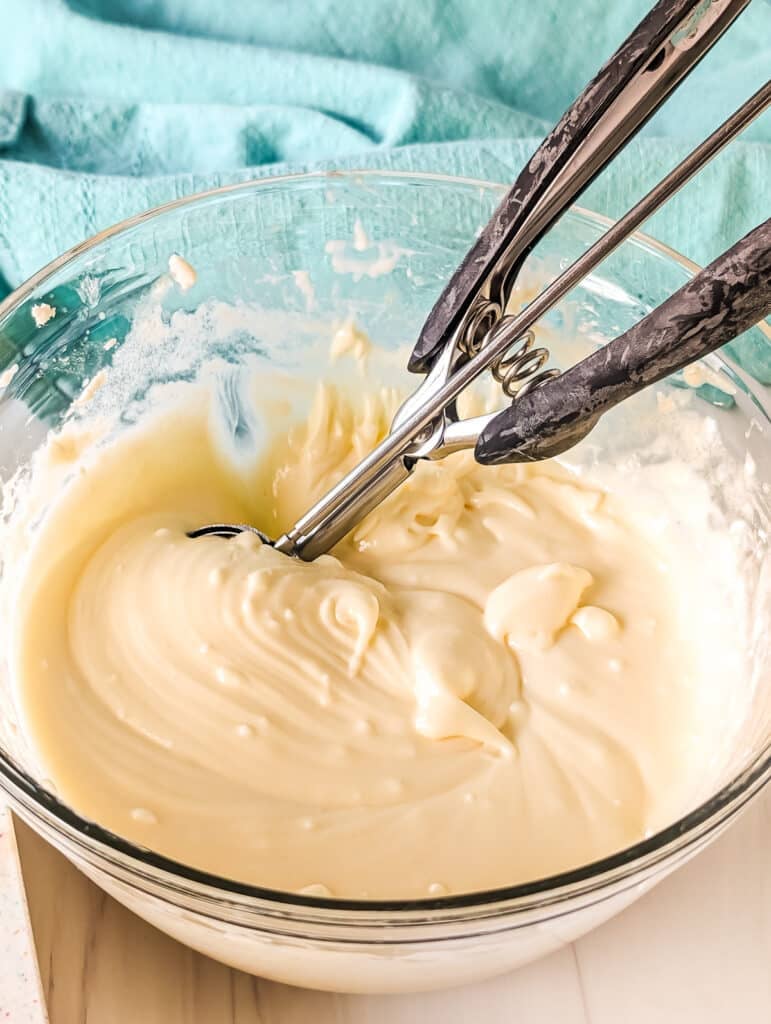 cheesecake filling in a mixing bowl.