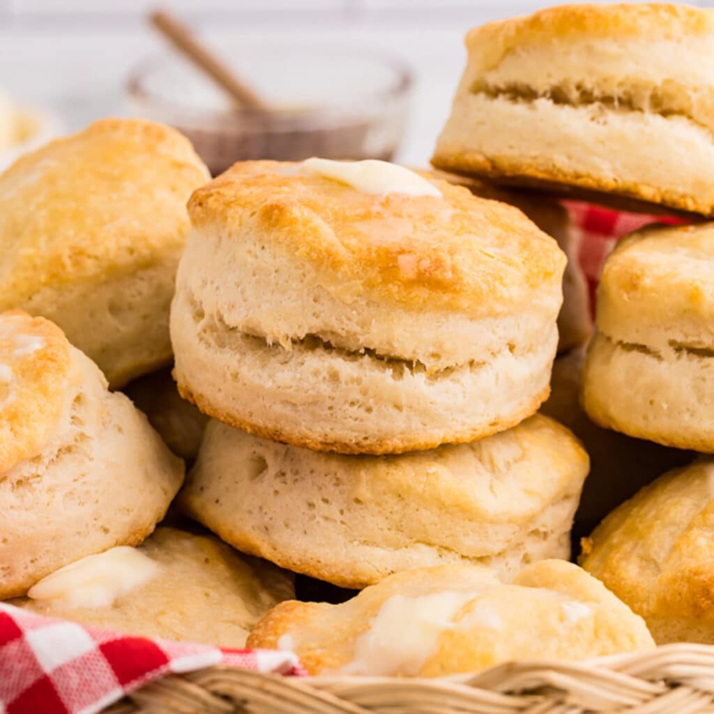 A basket filled with golden, freshly baked biscuits.