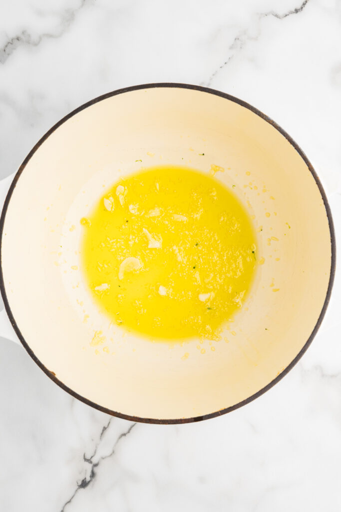 olive oil and minced garlic in the bottom of a pot.