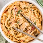 Creamy chicken pasta with sun-dried tomatoes in a bowl.