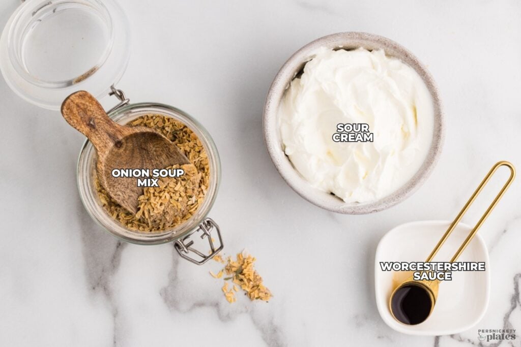 Ingredients for French onion dip including sour cream, onion soup mix, and Worcestershire sauce.