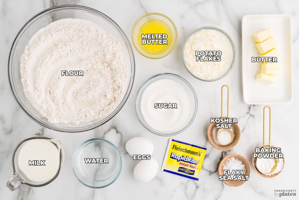 Ingredients for potato dinner rolls arranged on a countertop with labels.